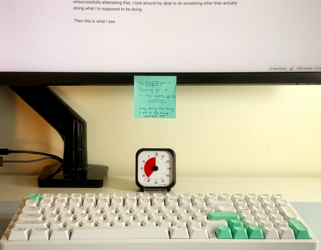 A sticky note on my monitor with a quote